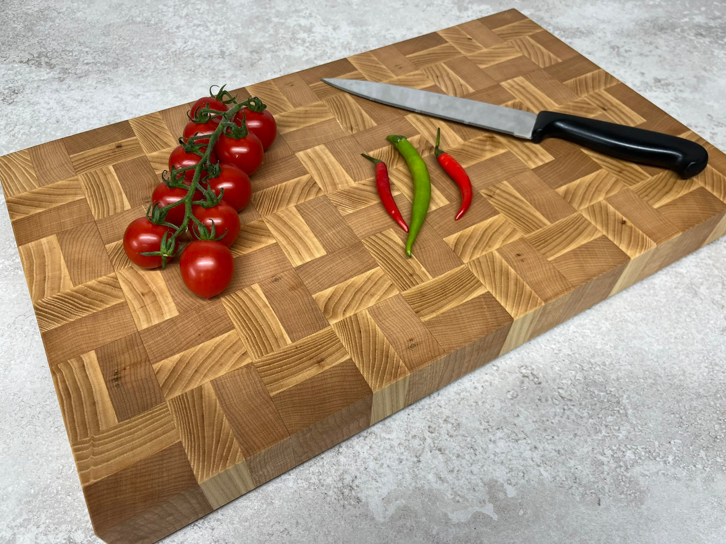 Cast and Wood handmade large end grain chopping board - Ash and Beech design - butchers block style - in use