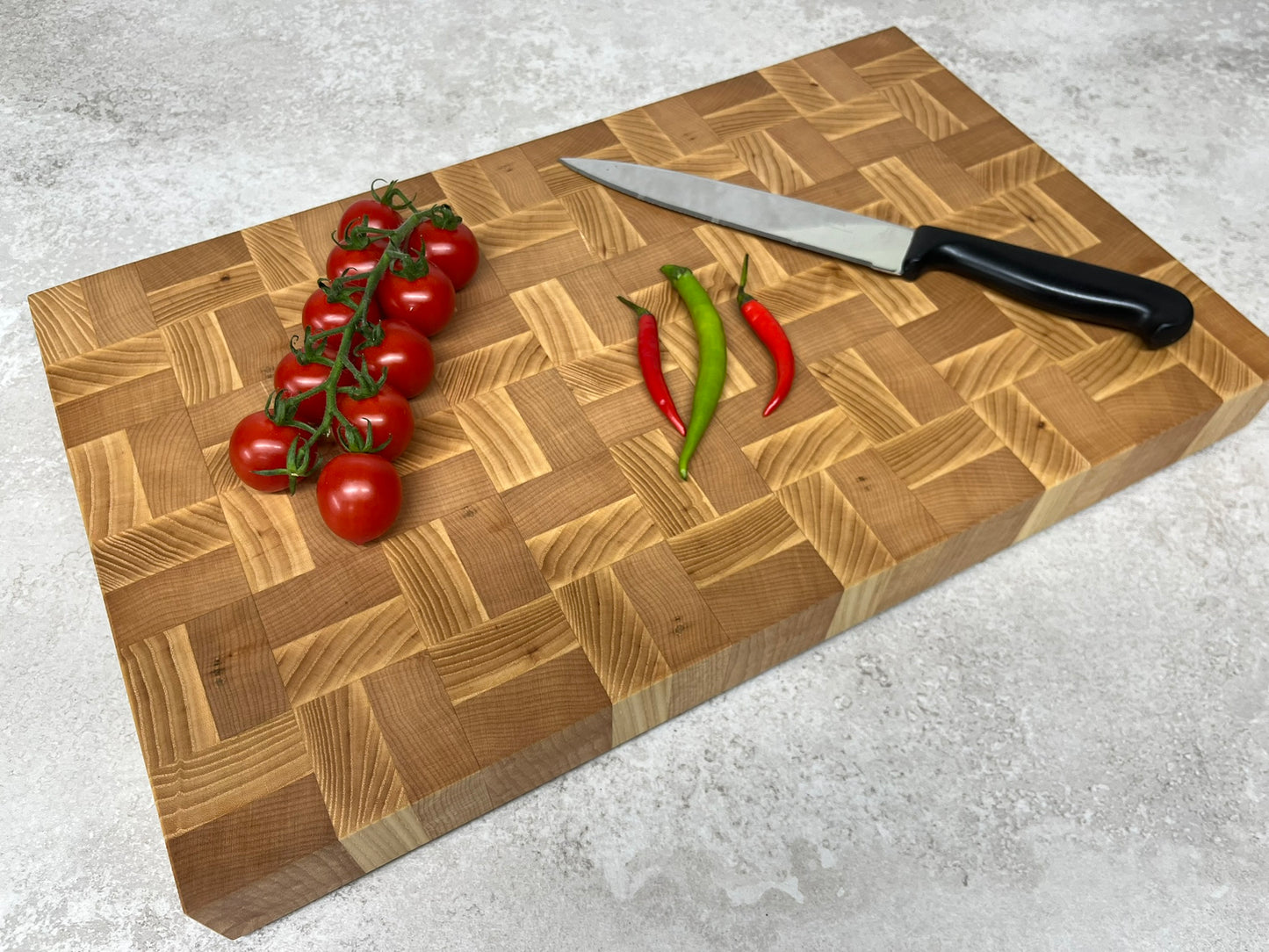 Cast and Wood handmade large end grain chopping board - Ash and Beech design - butchers block style - in use