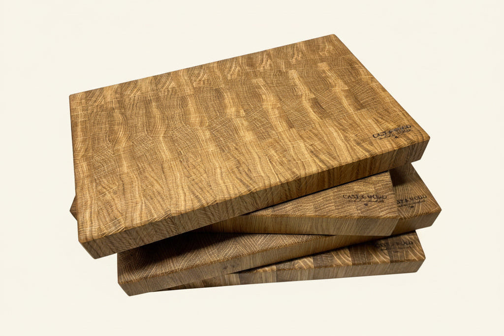 Pile of end grain oak chopping boards engraved with Cast & Wood logo