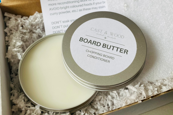 Tin of Board Butter for chopping board conditioning, presented in a box with shredded paper filling.