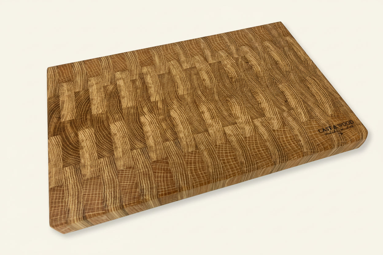 Large rectangular chopping board with a smooth natural wood finish and distinct end grain pattern.