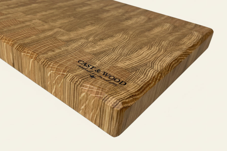 Large end grain chopping board with a textured surface and visible thickness, showcasing its unique design.