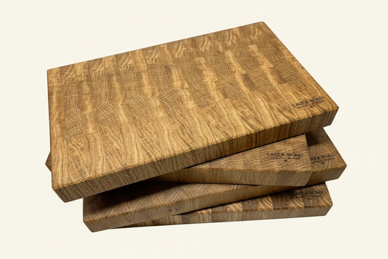 Stacked Heaton Large End Grain Chopping Boards showcasing distinct grain patterns and textured surfaces.