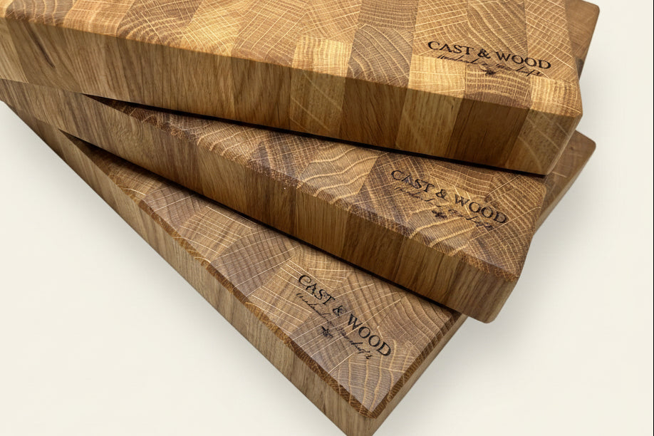 Three stacked Heaton Medium End Grain Chopping Boards showcasing a smooth surface and distinctive end grain pattern.