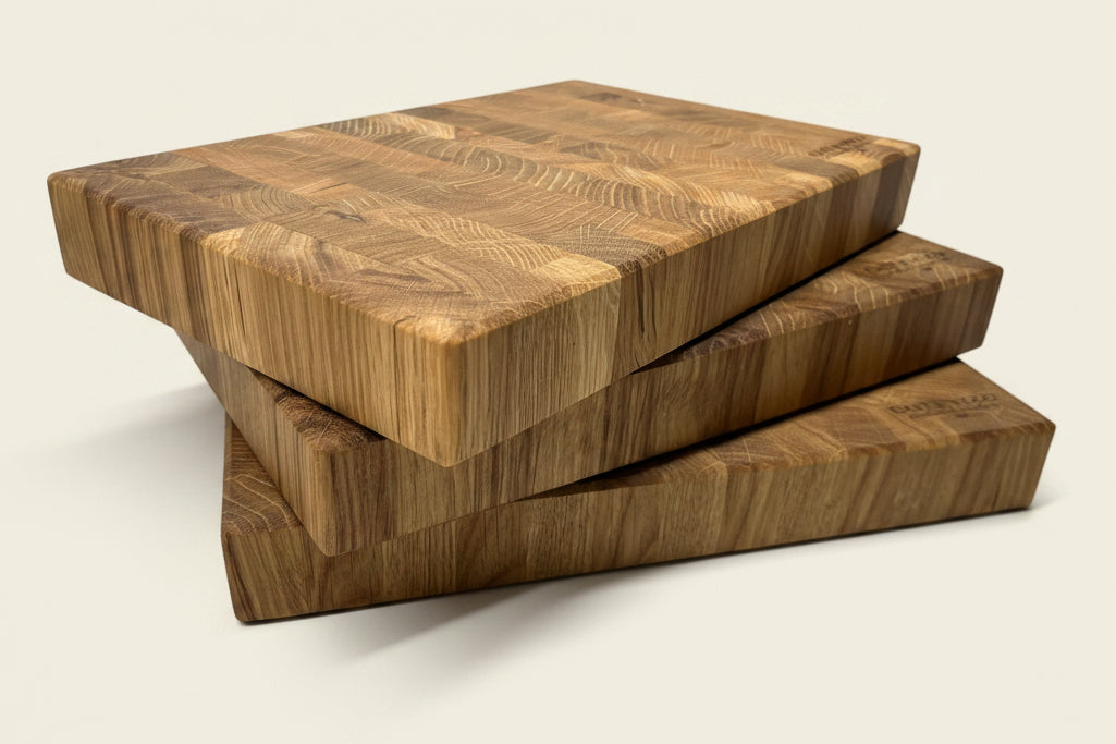 Three stacked Heaton Medium End Grain Chopping Boards showcasing a textured surface and unique end grain pattern.