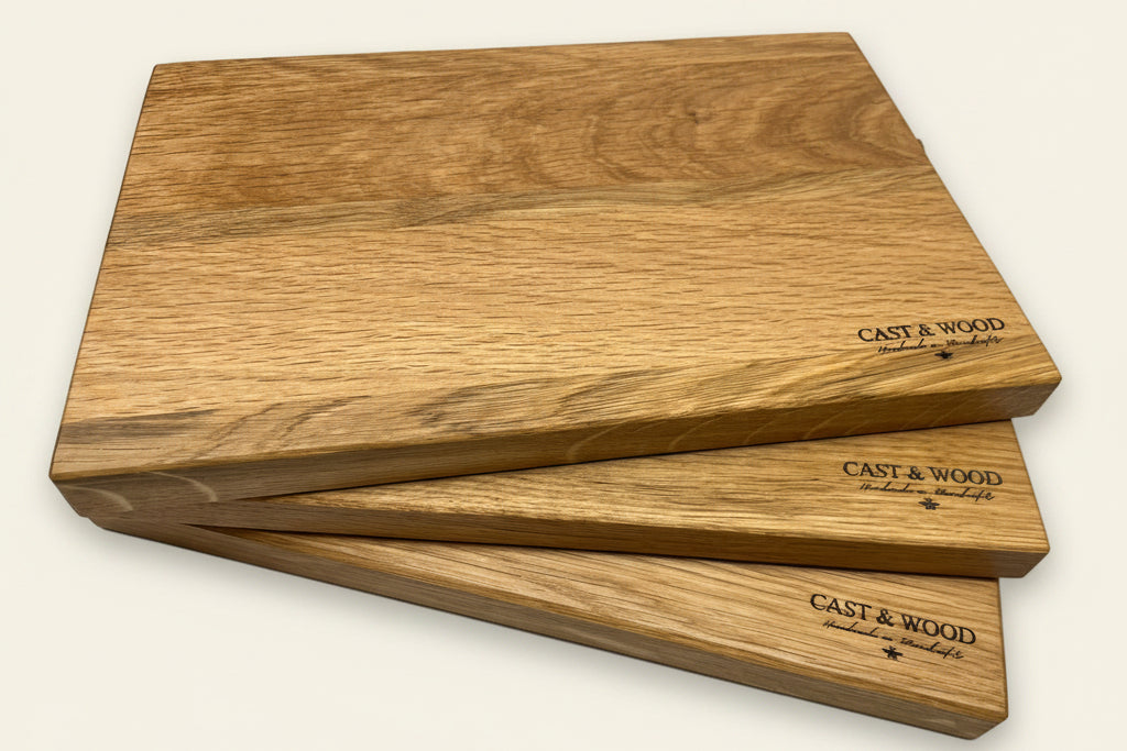 Three wooden chopping boards with smooth surfaces and rounded edges, featuring the CAST & WOOD logo.