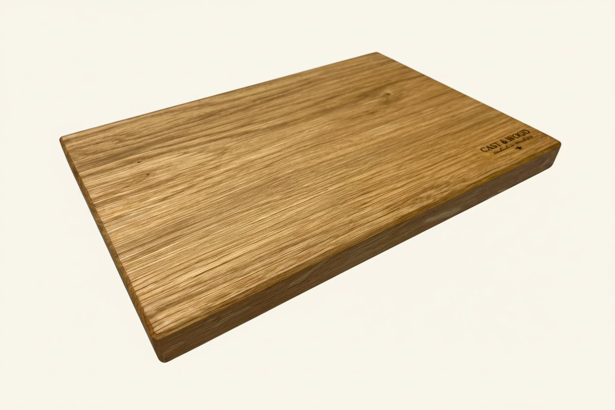 Rectangular oak chopping board with visible wood grain, showcasing a smooth surface and flat design.