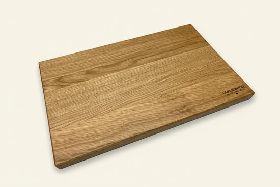 Wooden chopping board with smooth surface, natural grain pattern, and rounded edges from the Piccadilly Chopping Board set.