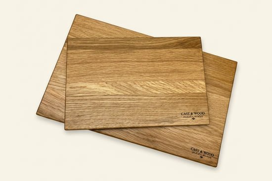 Two wooden chopping boards with smooth surfaces and natural grain patterns, showcasing the Piccadilly brand.