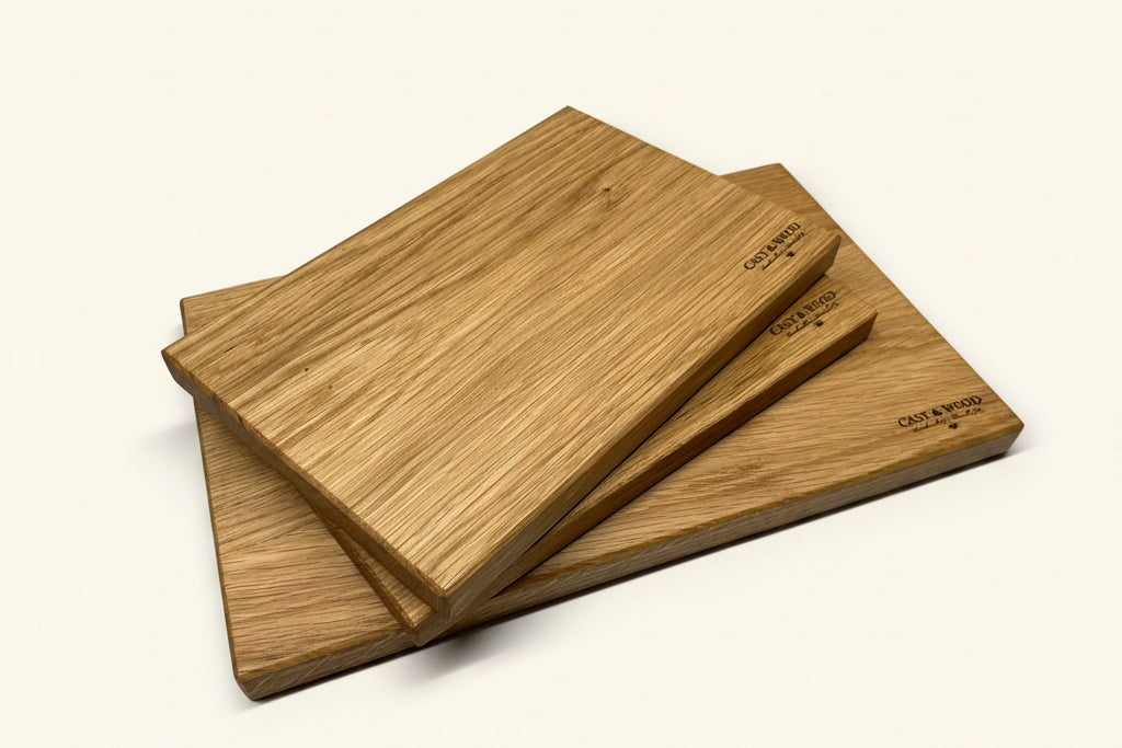 Set of three light wood chopping boards stacked together, showcasing a smooth surface and rectangular shape.