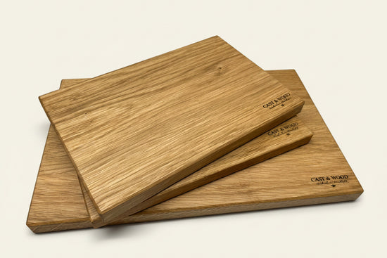 Set of three rectangular Piccadilly chopping boards stacked, showcasing a smooth wooden surface with light colour.
